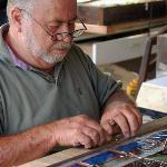 Master stained glass artisan, Lamar Yoakum copper foiling each piece of glass in the tree frog window.
Red-eyed tree frog, detail.